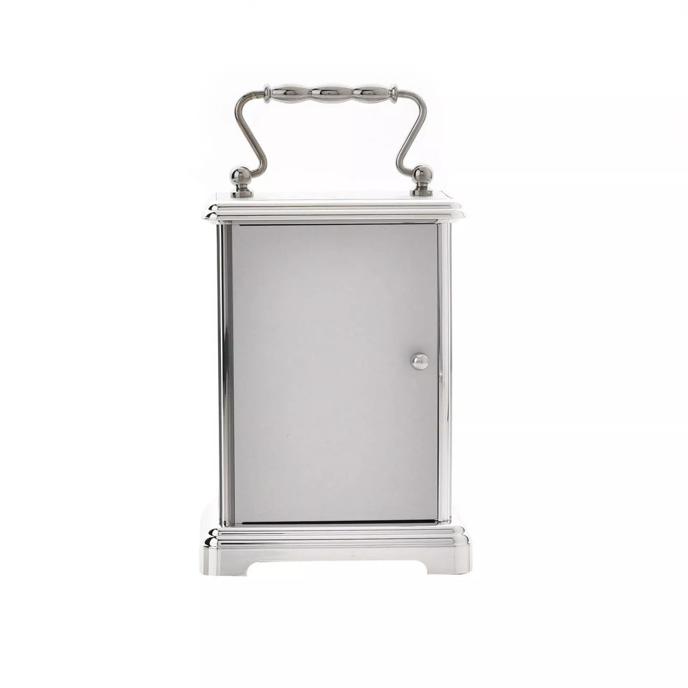 Widdop & Co silver carriage clock with classic design, detailed face, and ornate metal casing, a stylish vintage timepiece.